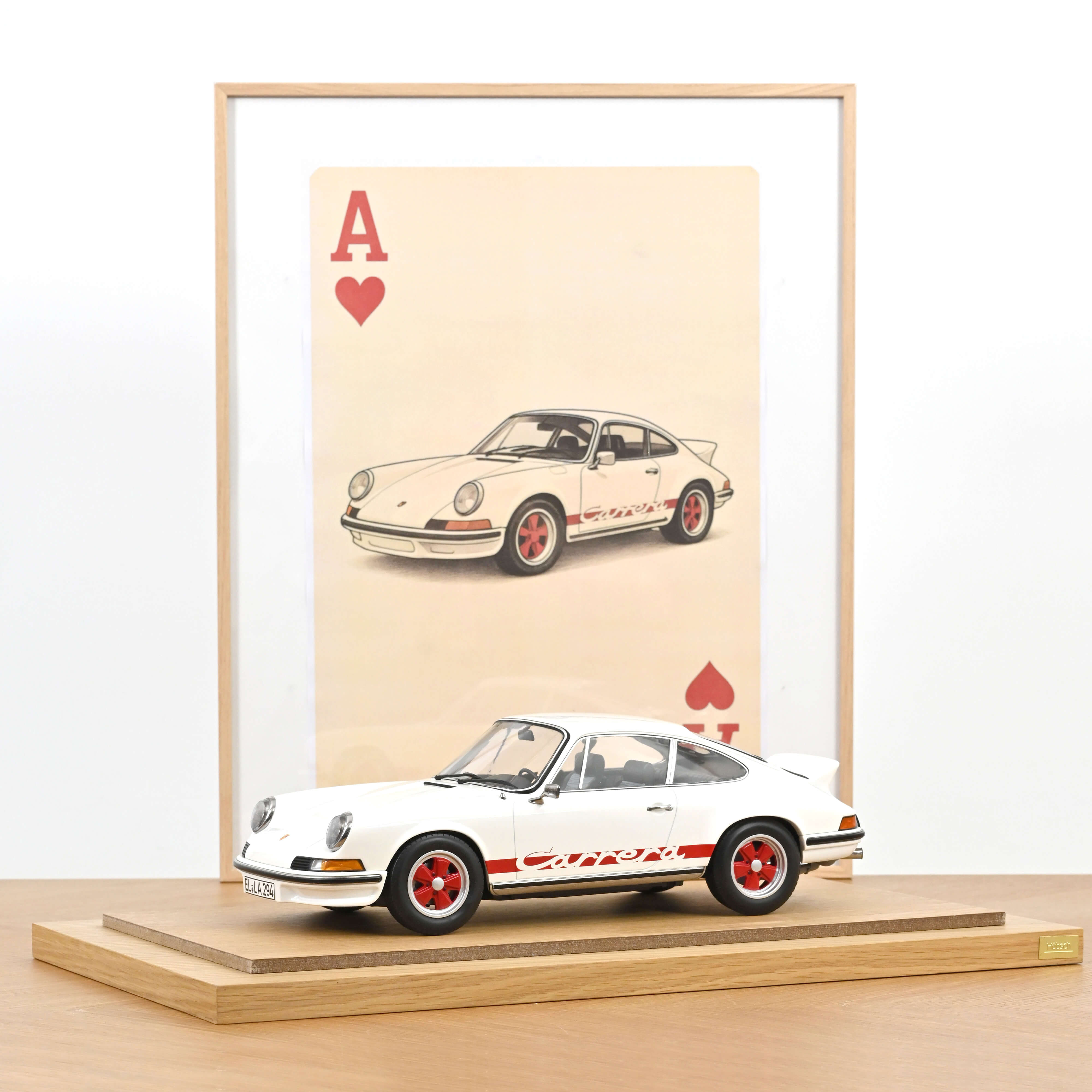 Porsche 911 Carrera RS 2.7 1973 Grand-Prix-White/Red 1:12 – Norev