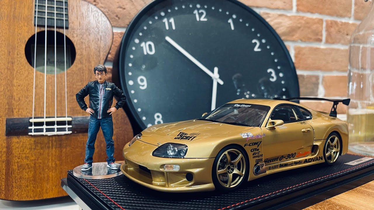 IG2484 TOP SECRET GT300 Supra (JZA80) Gold With Smoky Nagata 1:18
